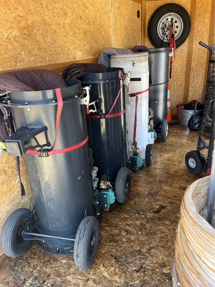 Used propane heat treatment heaters stored in an enclosed trailer.